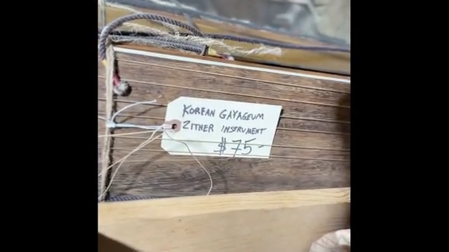 This instrument is called the kyogum, and yes, it's a 12 string harp from Korea.